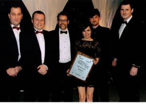 James, Paul, Gemma and Bruce celebrate Mackman's win together with members of the Colchester Business Awards panel