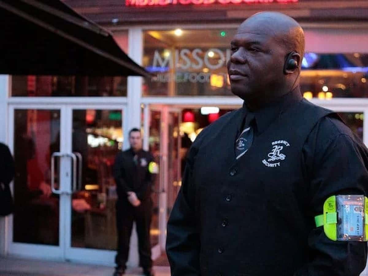 Security gaurd by a door