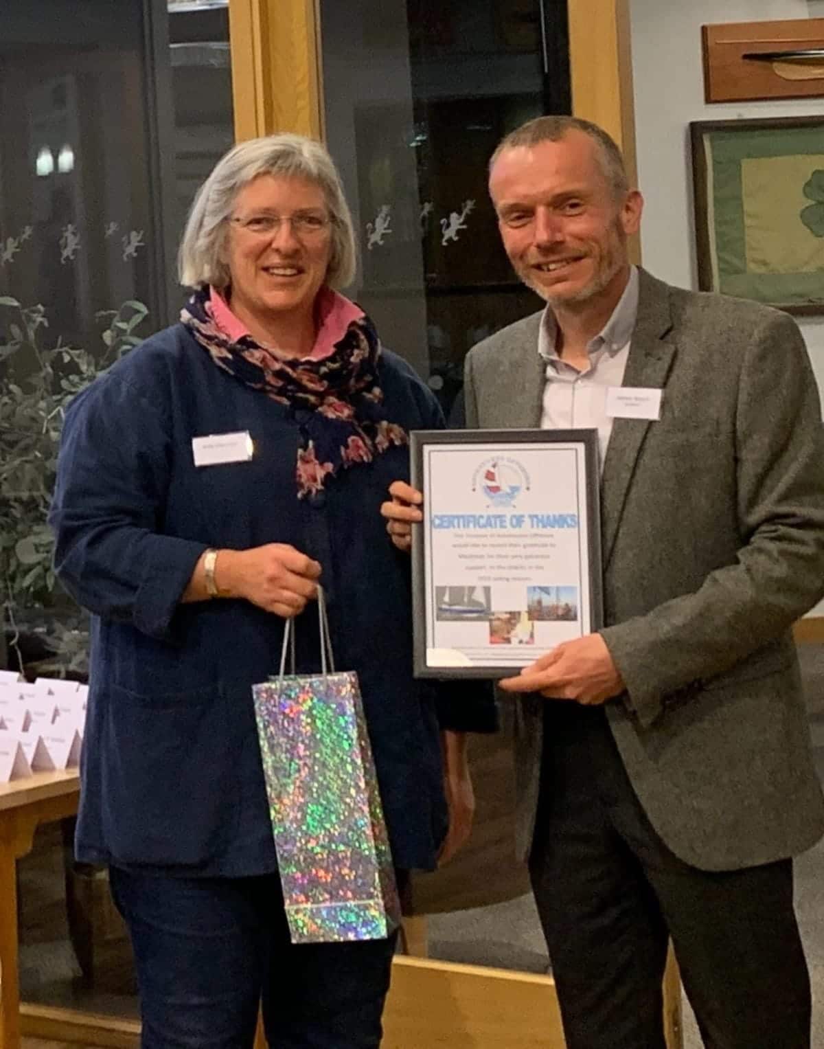 James receiving a certification of thanks