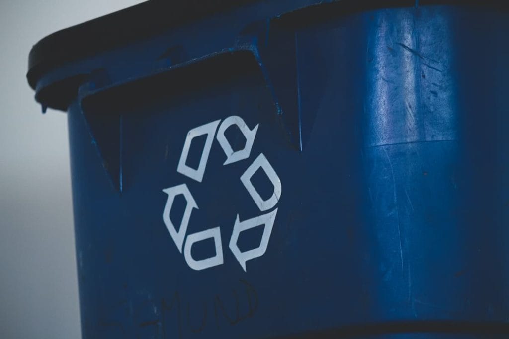 Blue Recycling Bin With Sign
