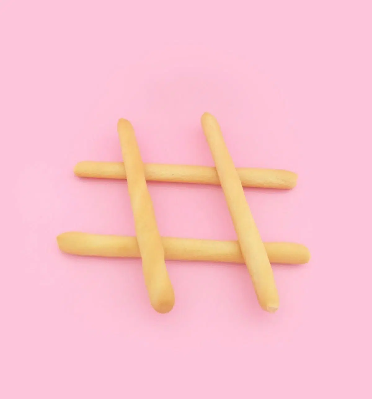 hashtag breadsticks in front of pink background