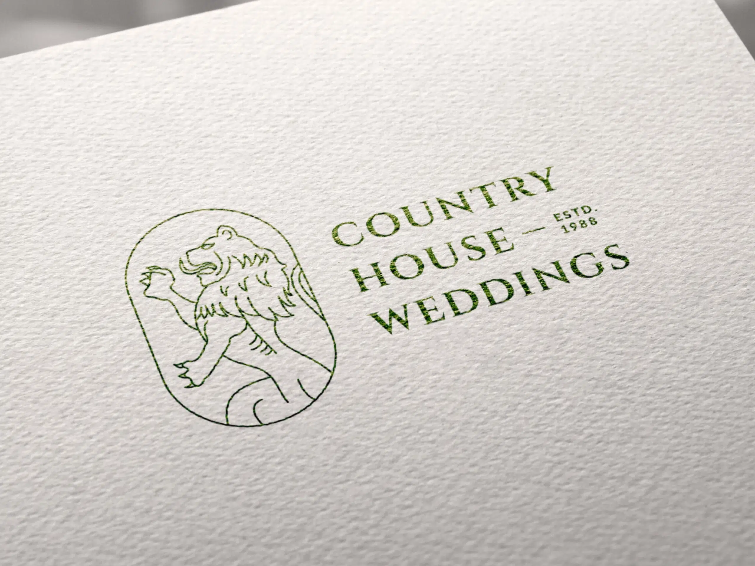 The Country House Weddings logo printed on textured paper